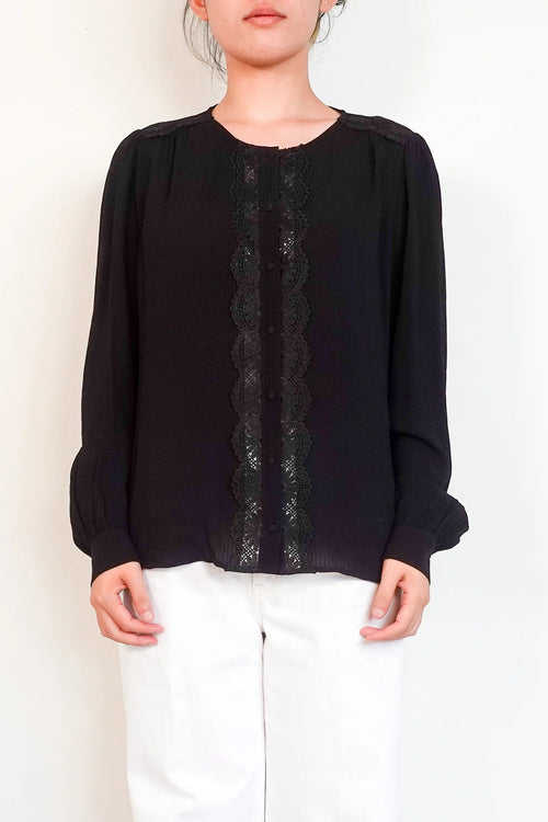 black blouse with embroidered detailing