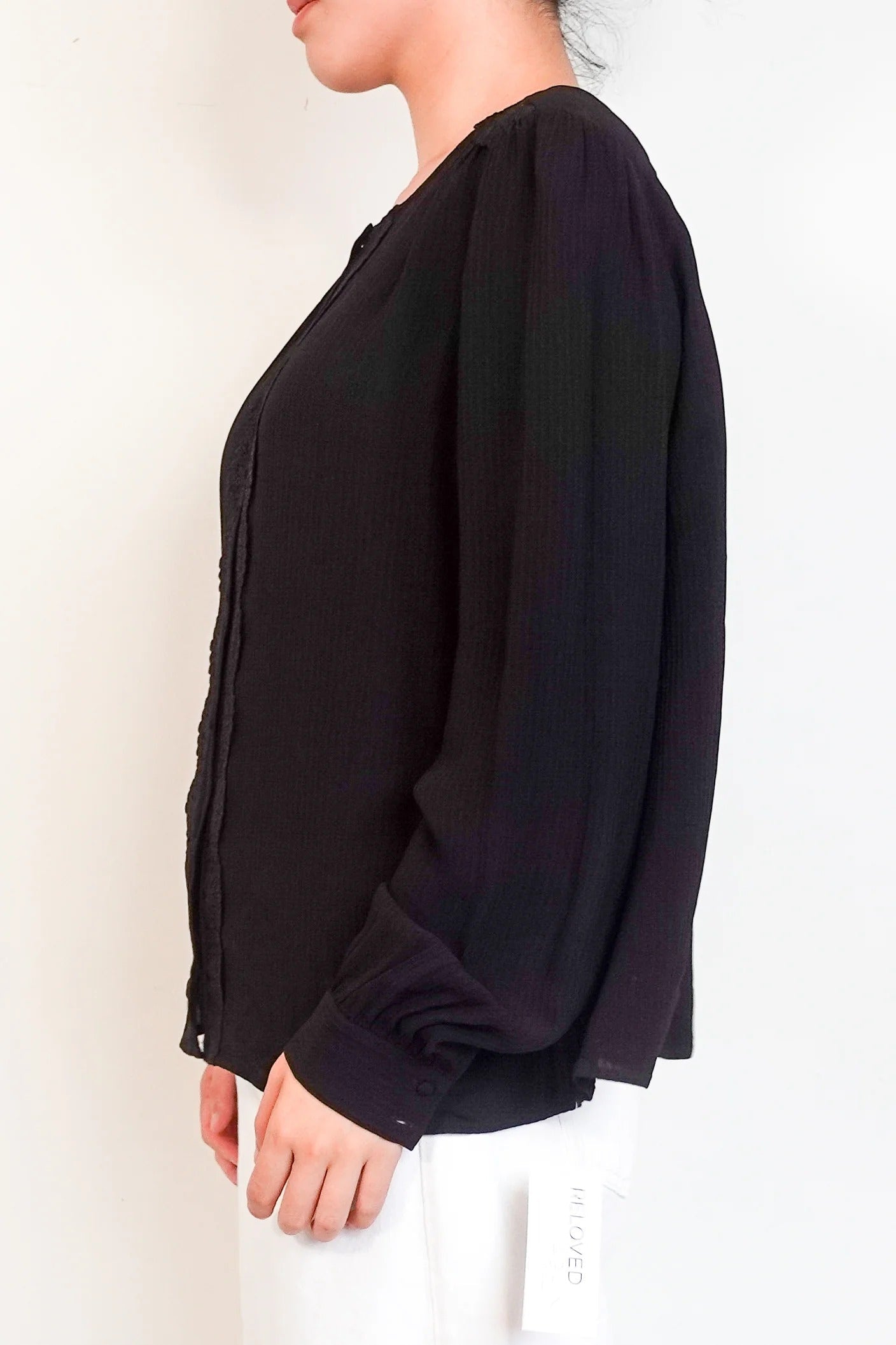 black blouse with embroidered detailing