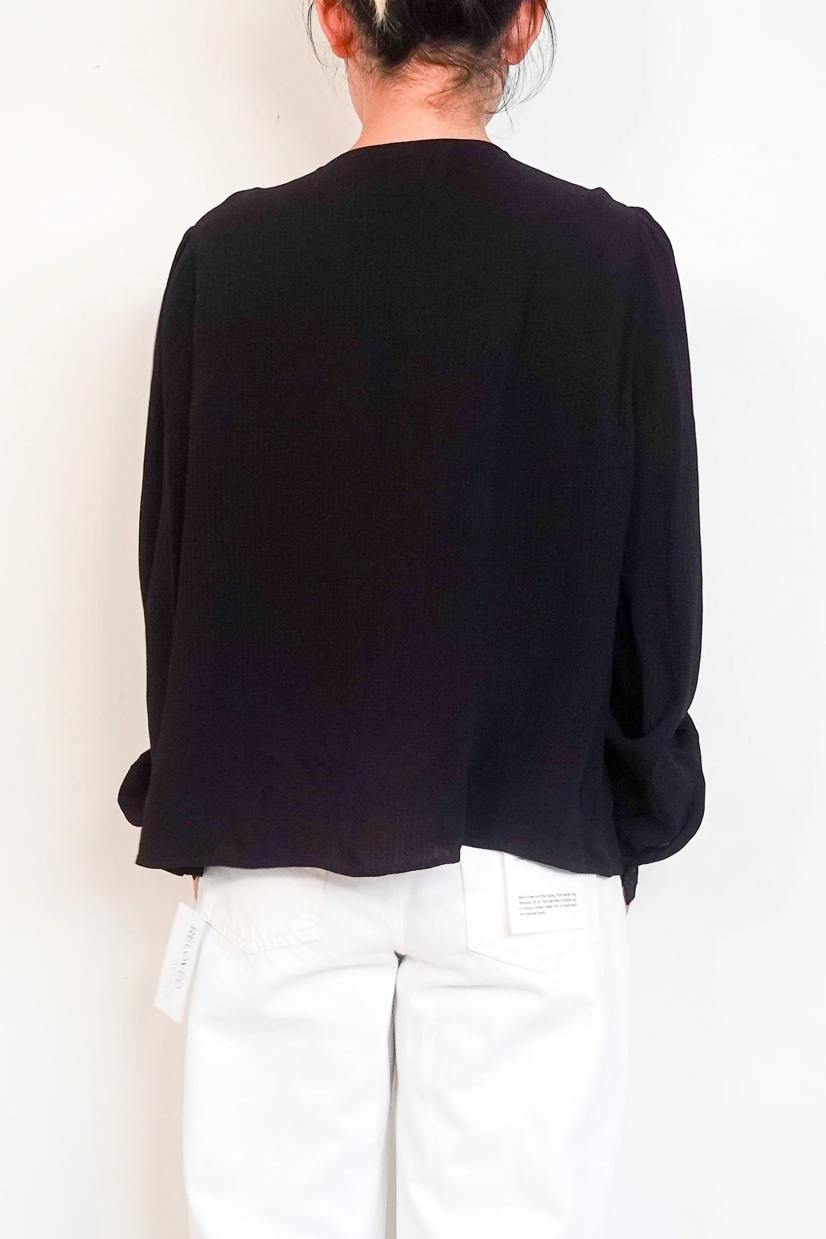 black blouse with embroidered detailing